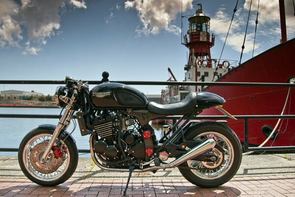 Triumphal motorcycle on the embankment