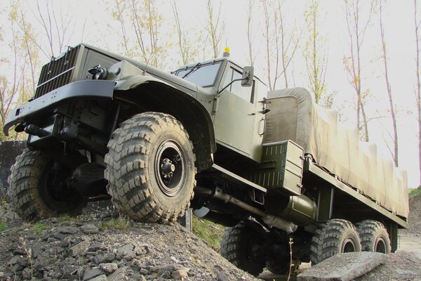 Military truck driving off-road