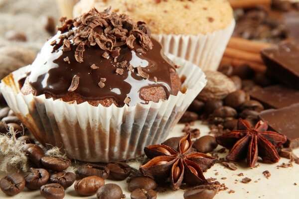 Delicious chocolate cupcake and coffee beans