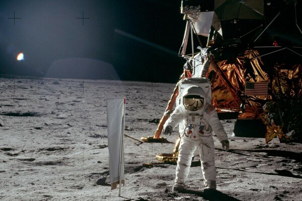 A US astronaut on the moon near his samalet