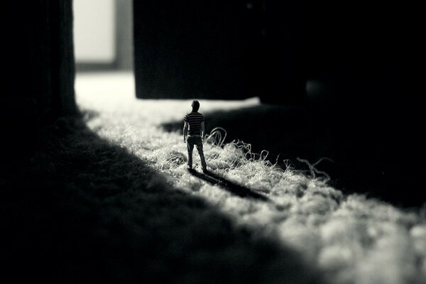 A toy man on a pile carpet