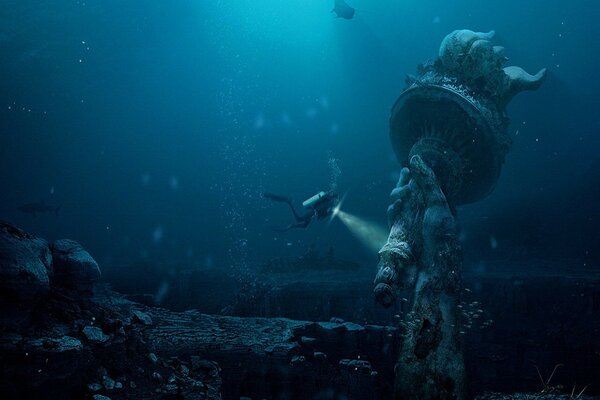 Scuba diver studies the ocean. Statue on the seabed