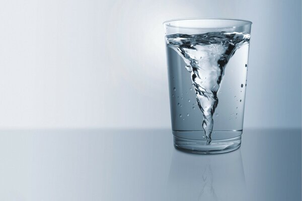 A whirlpool in a glass of clear water