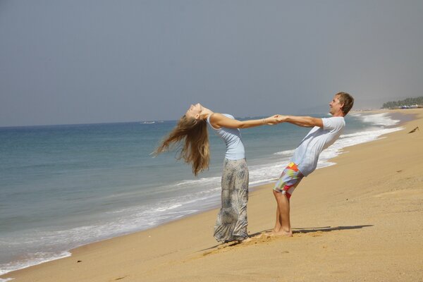 Couple in love dancing on the beach