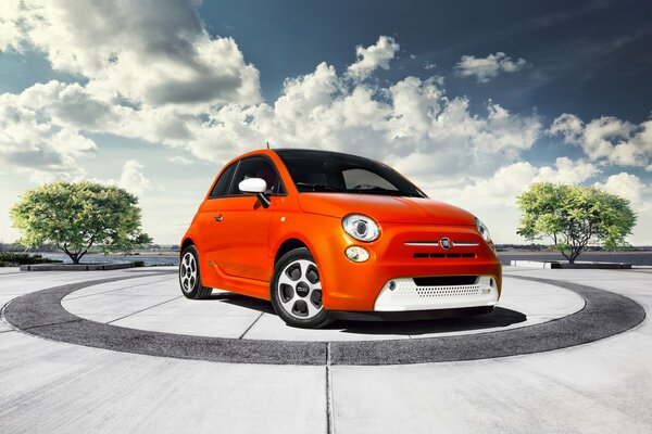 Italian car fiat 500e in orange