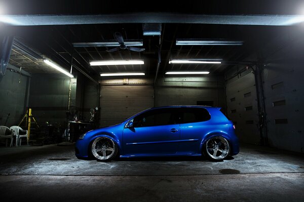 Blue Volkswagen with cool tuning in the garage