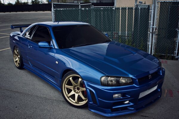 Blue Nissan with gold discs
