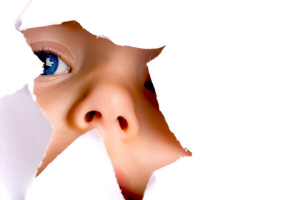 A child with blue eyes on a white background