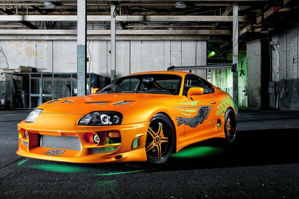 Orange Toyota Supra with backlight