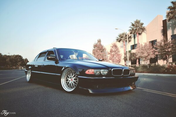 The beautiful bmw e38 stands in an unusual position