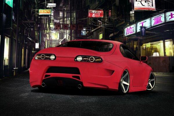 Toyota Supra in red in the middle of the night city