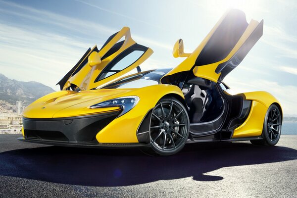 Yellow mclaren with open doors butterfly wings