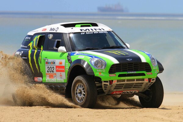 Mini Cooper with a green front in the desert