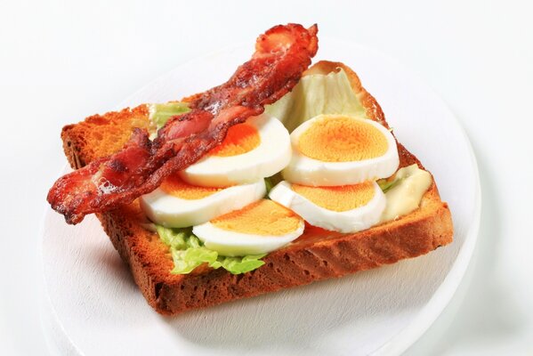 Toast with boiled egg and bacon