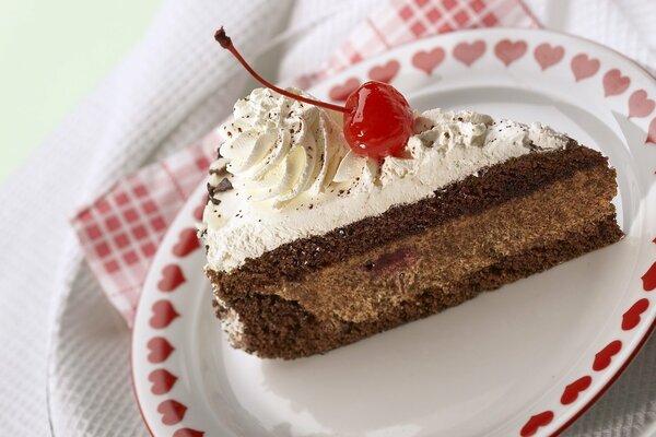 A cake on a burner decorated with cherries