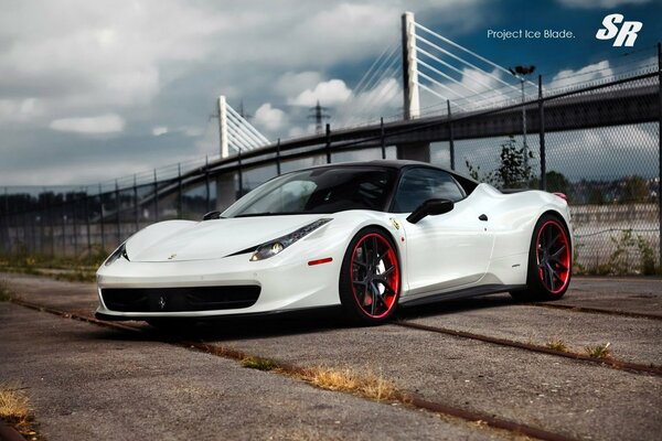 Ferrari car on the background of the bridge