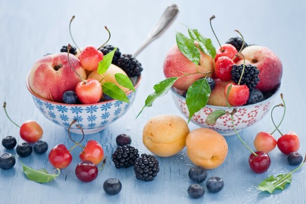 Berries and fruits in beautiful bowls