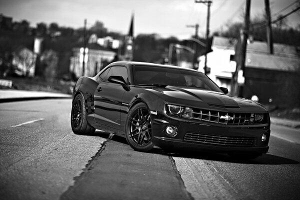 Black and white photo of Chevrolet in the city