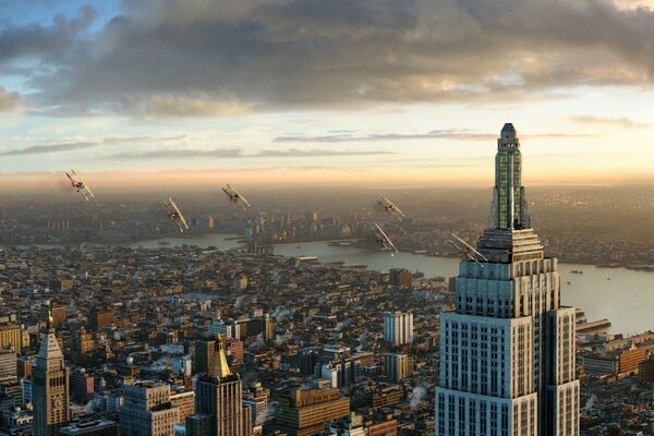 Planes fly over the metropolis at dawn