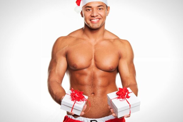 Sexy tanned santa with gifts