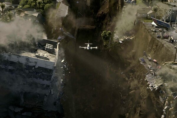 Samolot na tle zniszczonego miasta