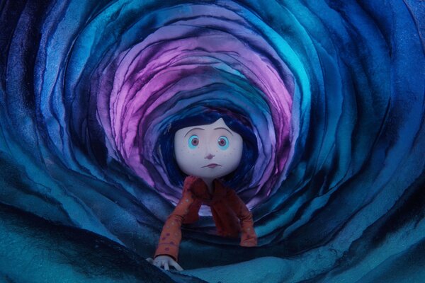 Coraline climbs through a tunnel in the land of nightmares