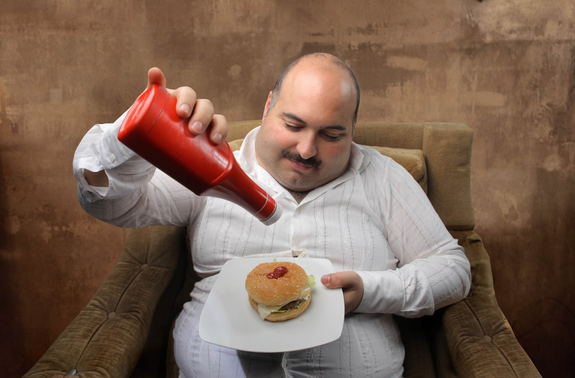 the stomach man ketchup fast food chair