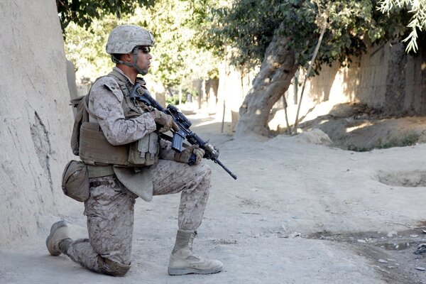 A soldier with a gun in his hands