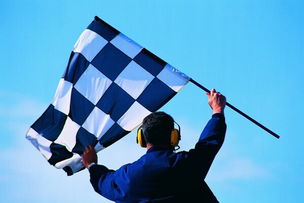 A man with a flag at the start