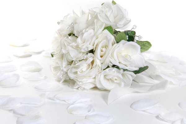 Romantic and delicate bouquet of white roses with beads