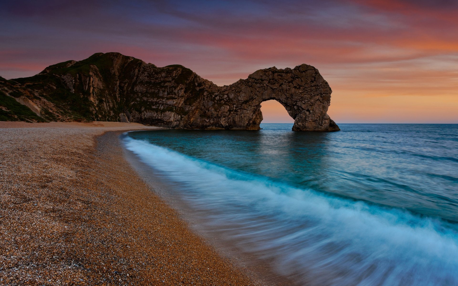 bogen bögen natur landschaft meer wasser ozean küste ufer strände kiesel stein steine abend sonnenuntergang felsen felsen grotten