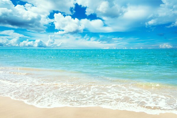 Image of the sea coast with beige sand