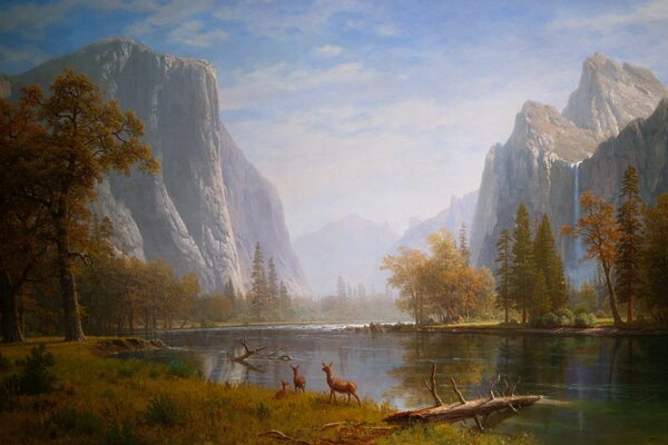 Animals on the background of mountains with waterfalls near the reservoir