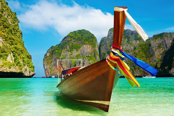 Wooden boat on the shore of paradise beach