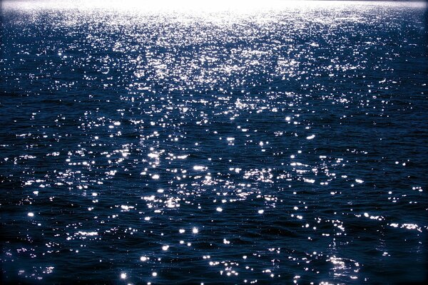 The glare of the sun on the water