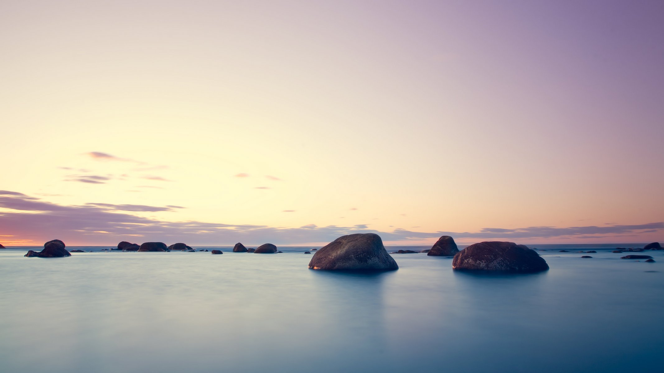 puesta de sol mar piedras cielo