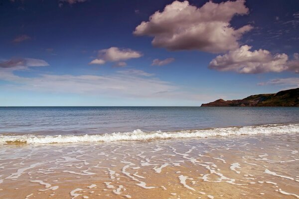 The horizon of the seashore with a blue sky