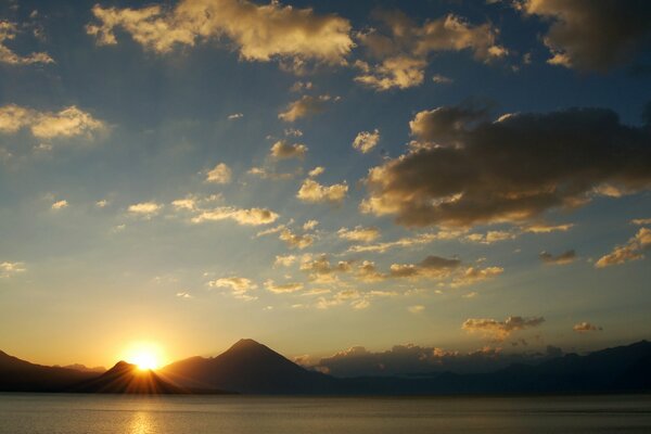 Sunset in the mountains on the background of the sea