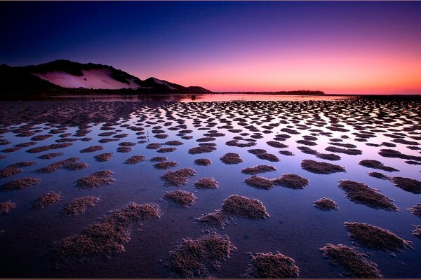 Beautiful sunset on the sea in the mountains