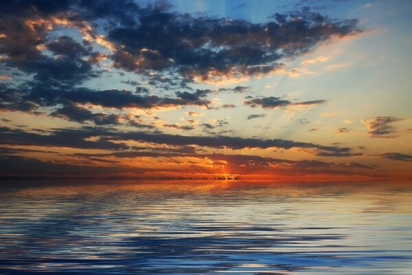 Clouds are rising on the horizon over the ocean