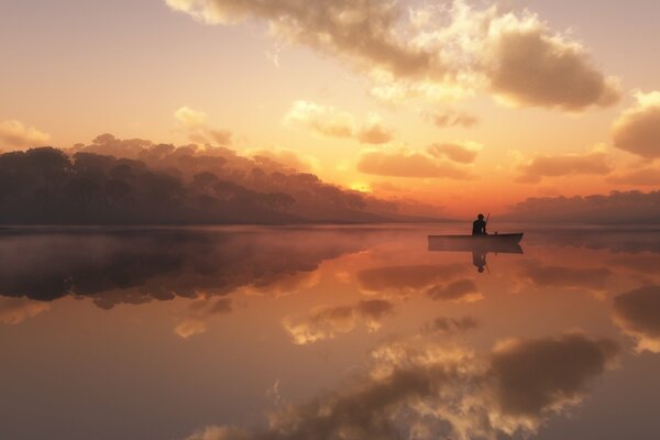 Fisherman on a boat on a foggy lake