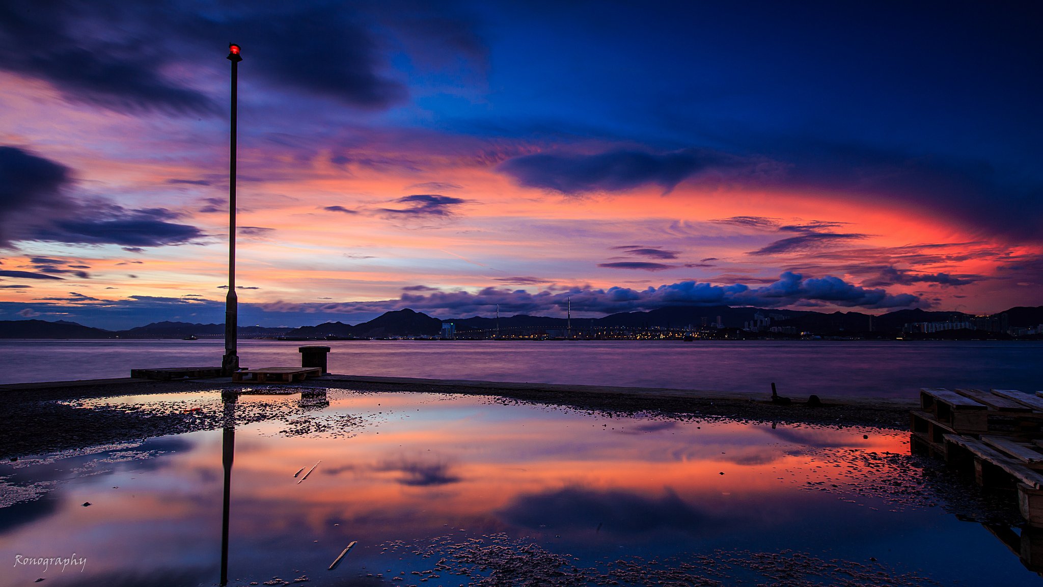 dawn ocean mountain town pier