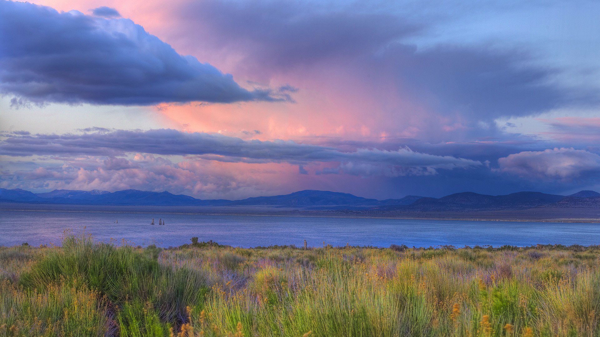 ky clouds clouds sunset river shore grass horizon mountain