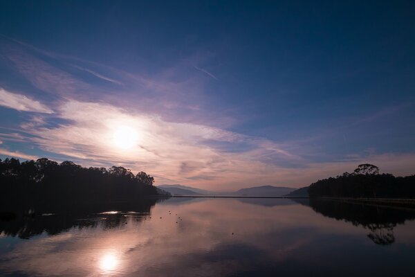 Dawn by the lake in the forest