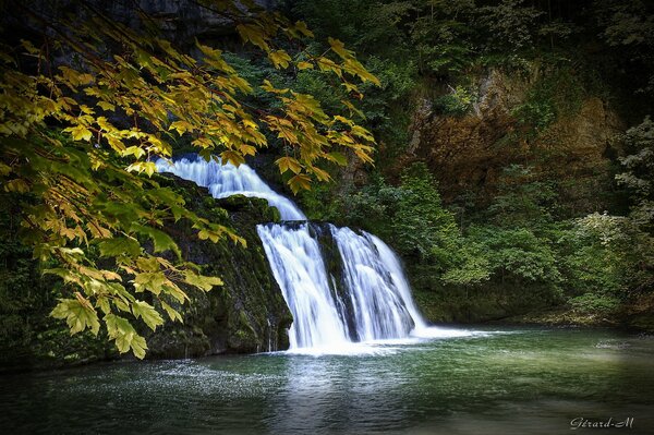 A raging waterfall on an autumn day