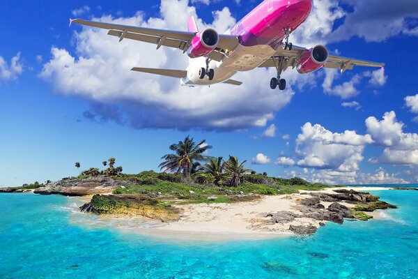 Fliegendes Flugzeug über einer tropischen Insel