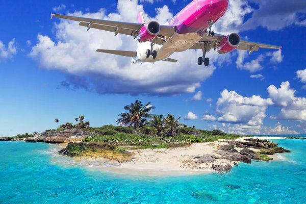 Avión volando sobre una isla tropical