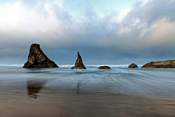 Rocky seashore. Cloudy sky