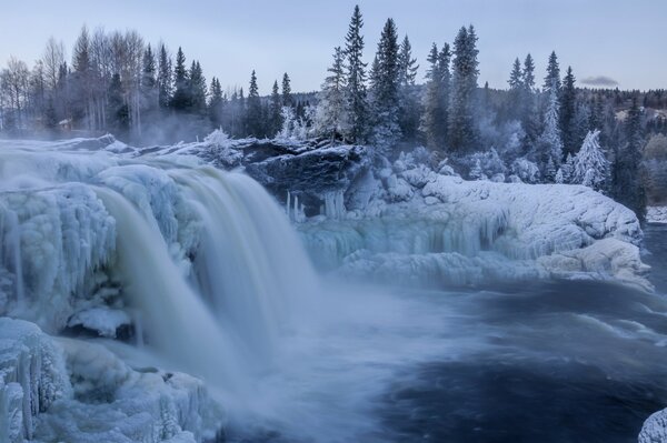 Winter ice waterfall made of snow