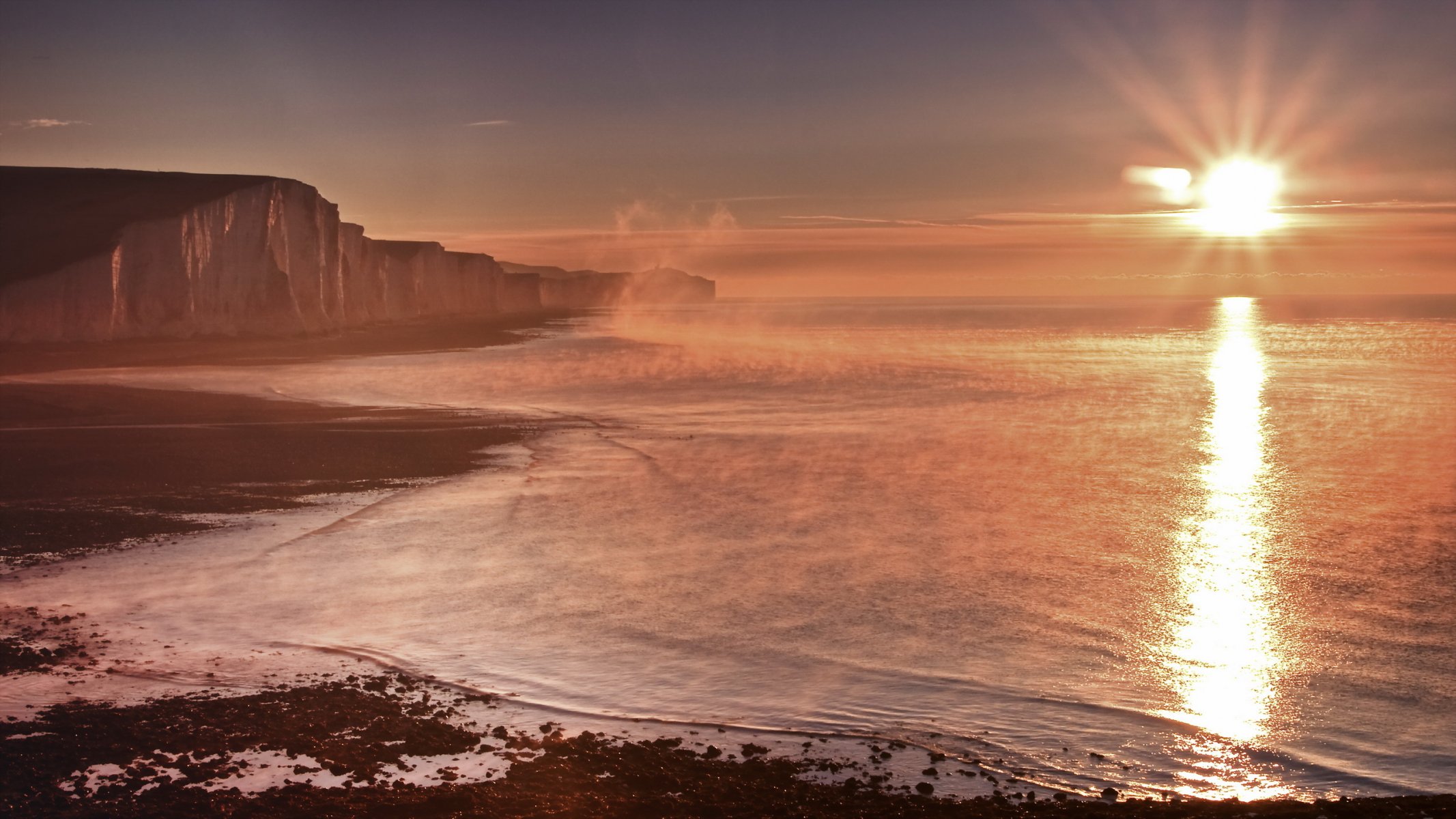 inghilterra cuckmere haven tramonto mare nebbia